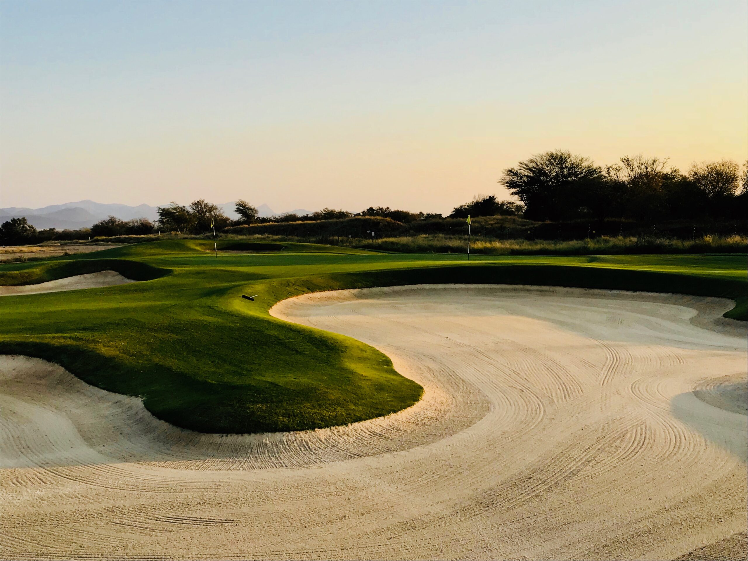 Sunset on a golf bunker.