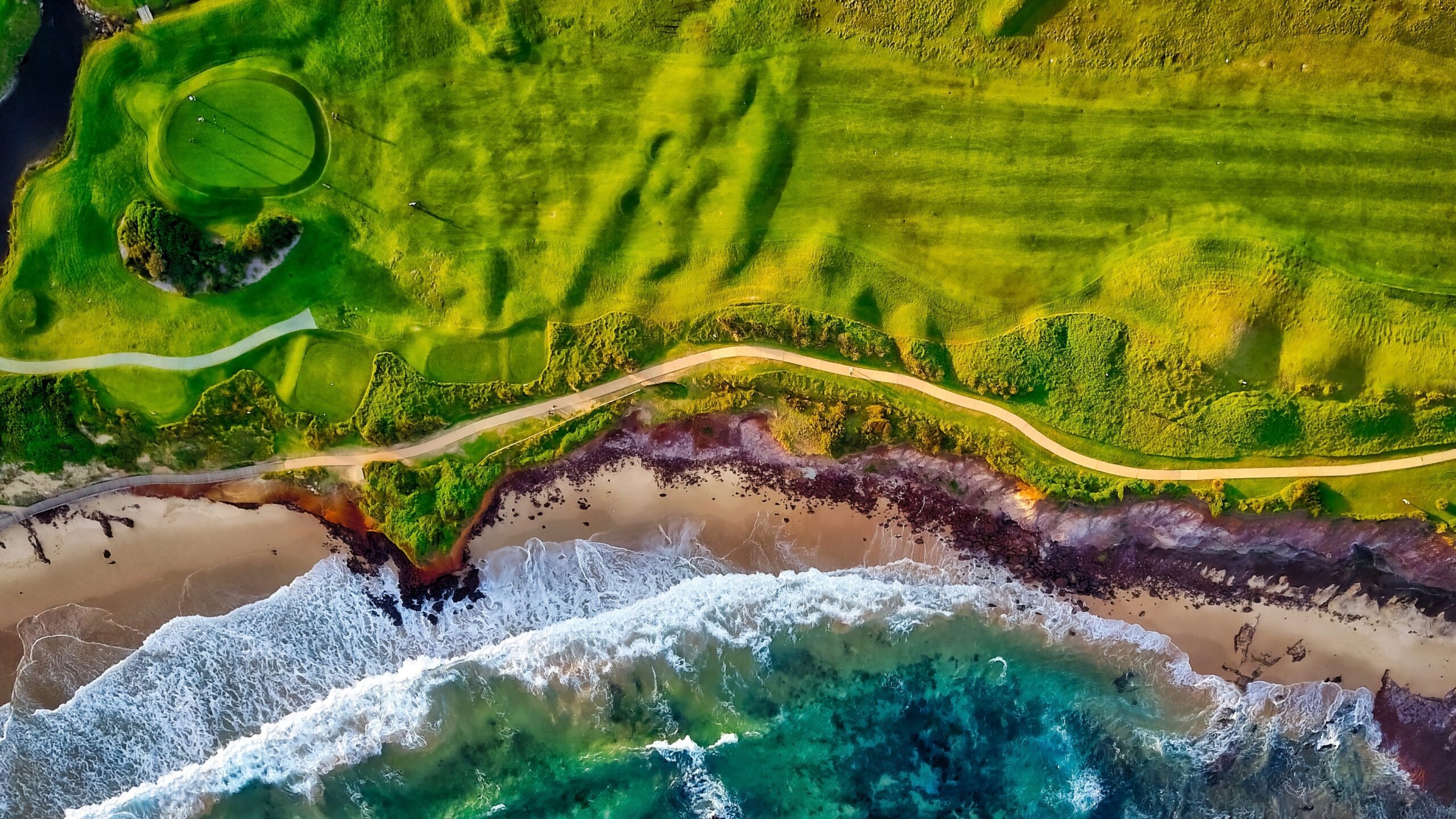 Aerial view of a coastal golf course.